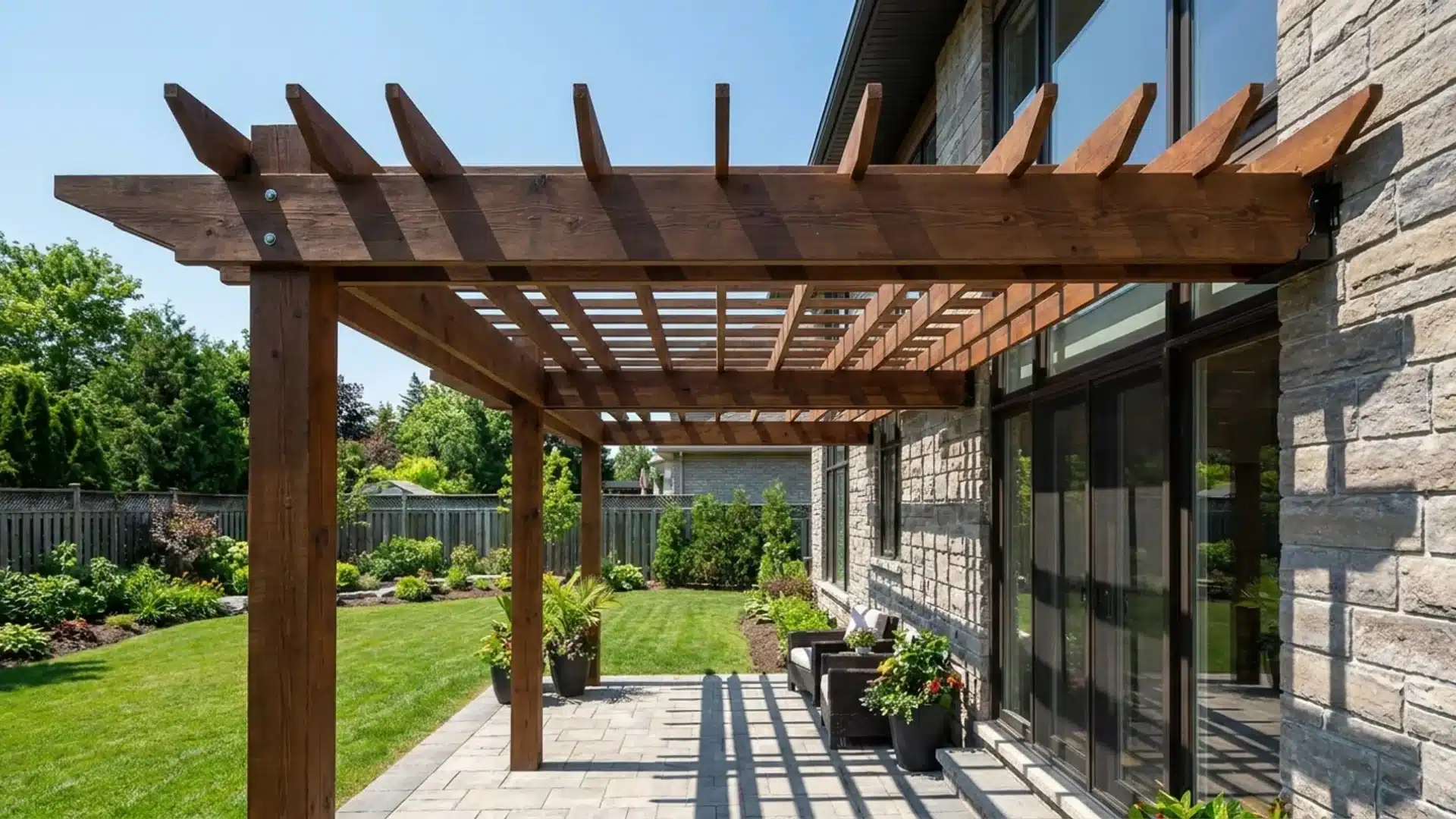 Ledger board attached to wall framing for a house pergola structure.