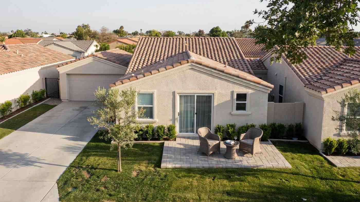 Single-story patio home with a shared wall and small private patio out front